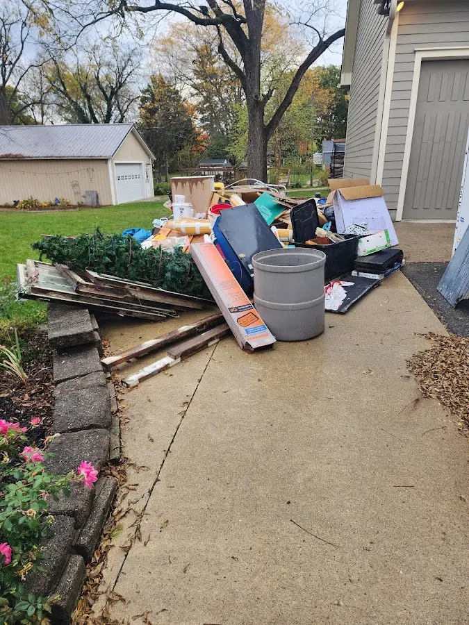 Dumpster being loaded with debris for 3 Yard Dumpster Rental in Mabank